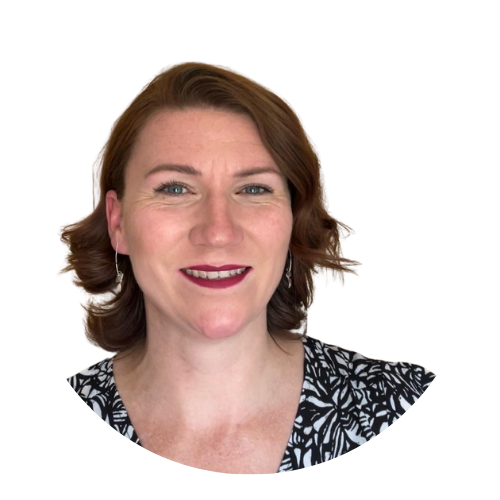 Portrait of Jaimie-Lee Kevill, Sundowns Board Member, smiling with short auburn hair, wearing a black and white patterned top.