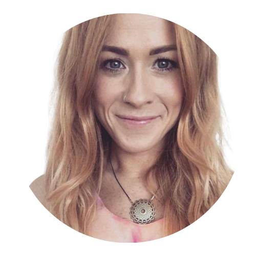 Portrait of Ana Harrison-McCormack, Sundowns Board Member, smiling with long, wavy auburn hair and wearing a circular pendant necklace.